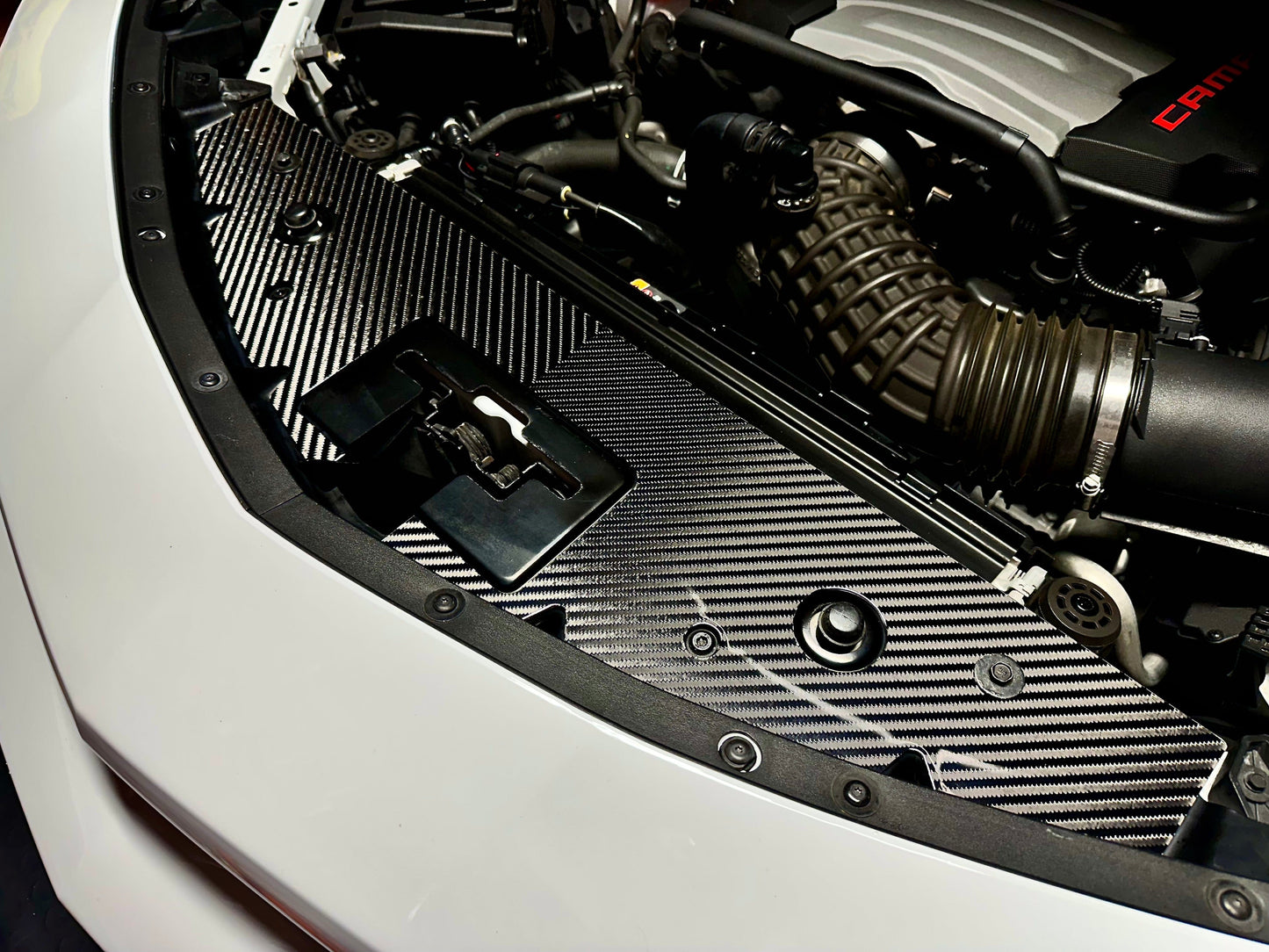 Carbon fiber 4x4 v-twill camaro engine cover installed in engine bay
