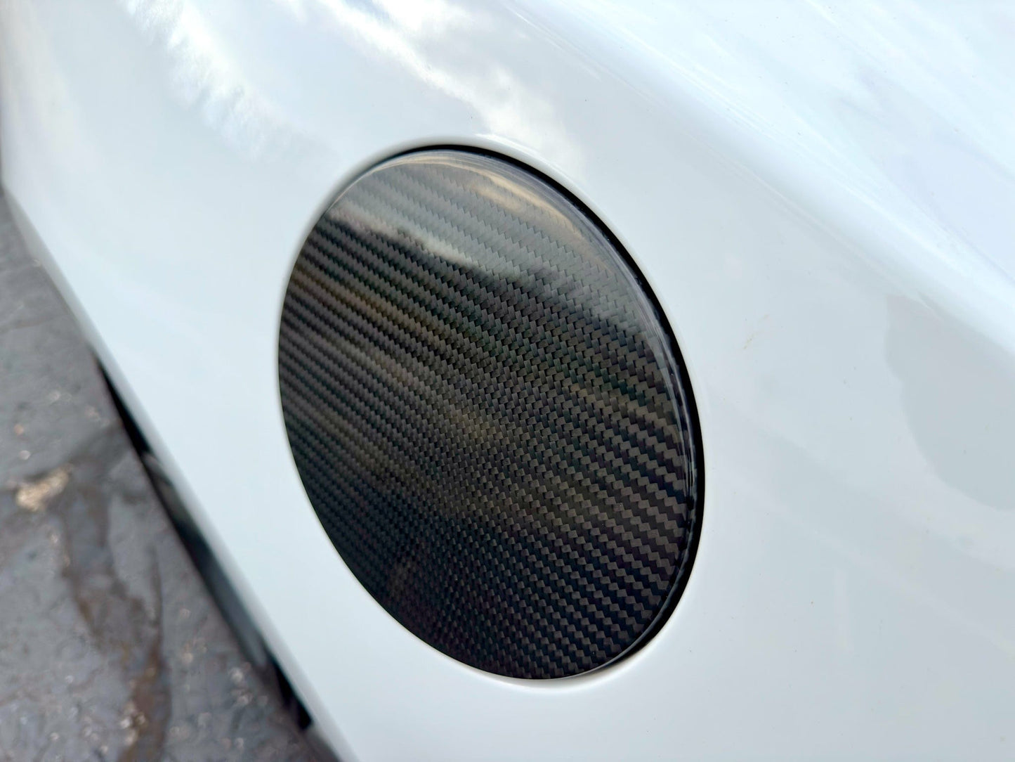 Camaro carbon fiber fuel door cover on white camaro