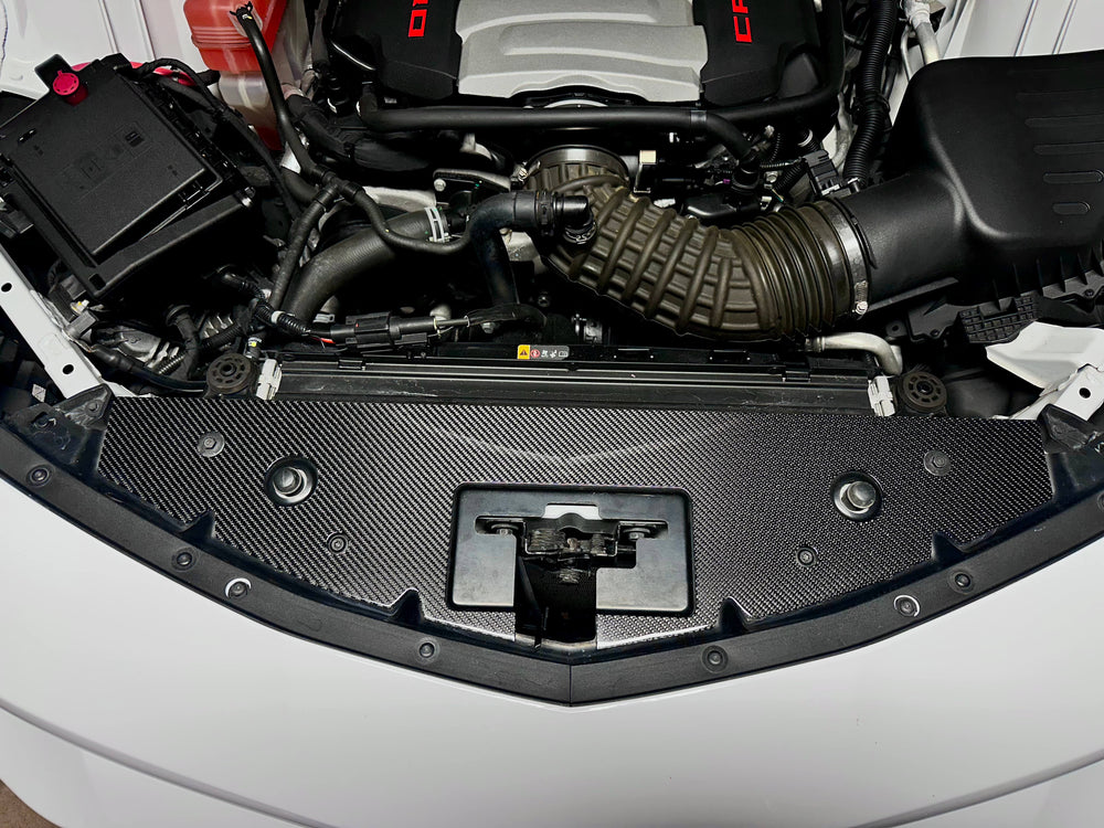 Carbon fiber radiator cover installed on 6th Gen Camaro engine bay