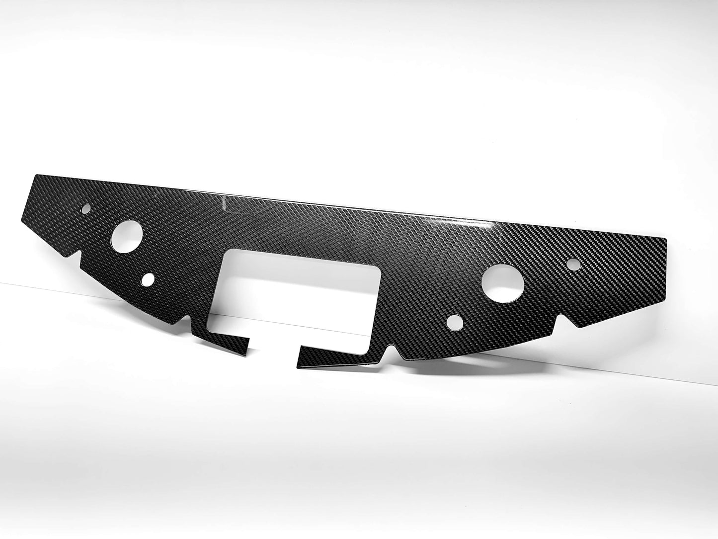 
                  
                    Gloss 2x2 twill carbon fiber weave – Camaro radiator cover angled view white background
                  
                