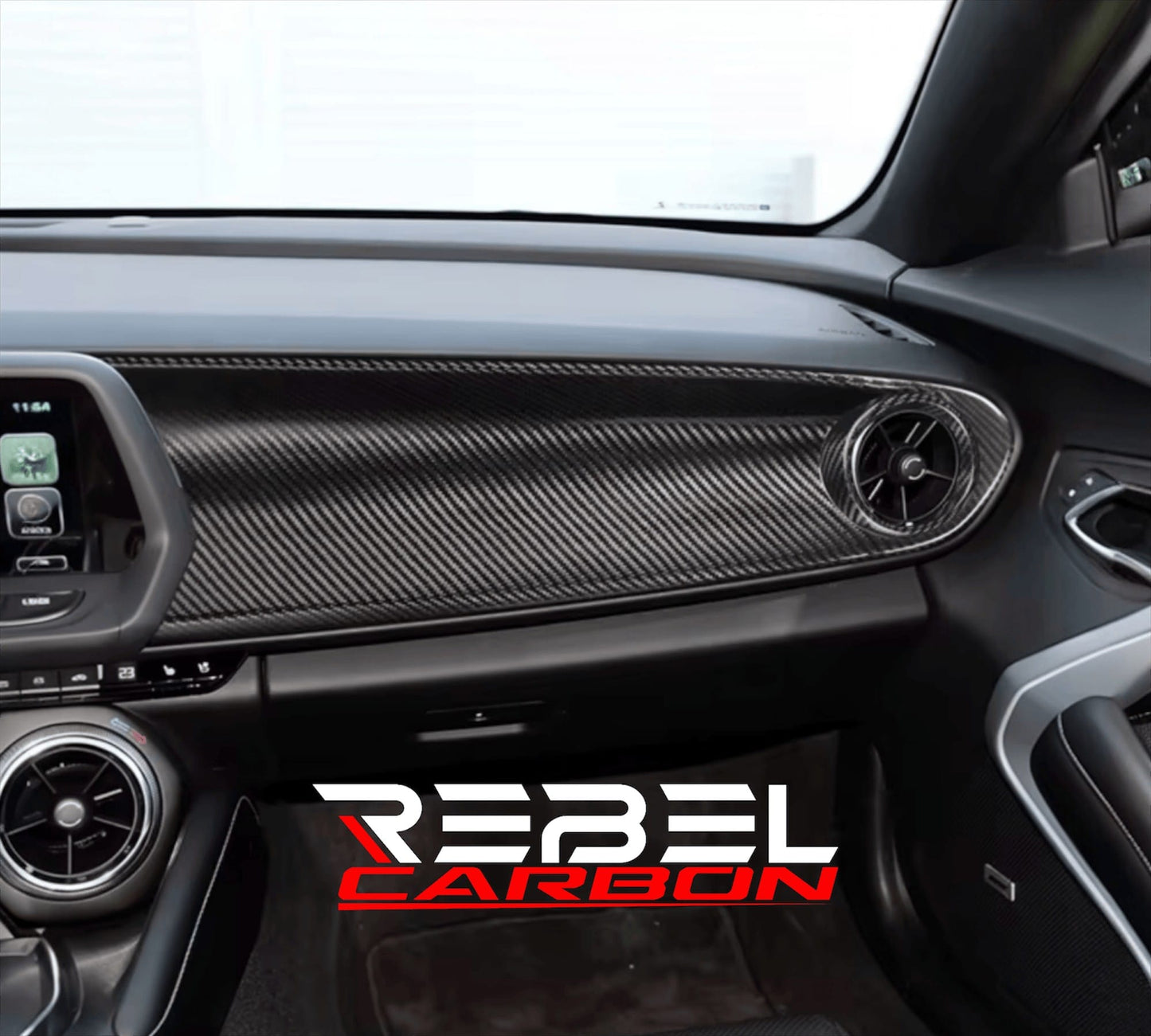 Rebel Carbon Fiber passenger dashboard trim cover with a glossy 2x2 twill weave installed in a 6th-Gen Camaro interior