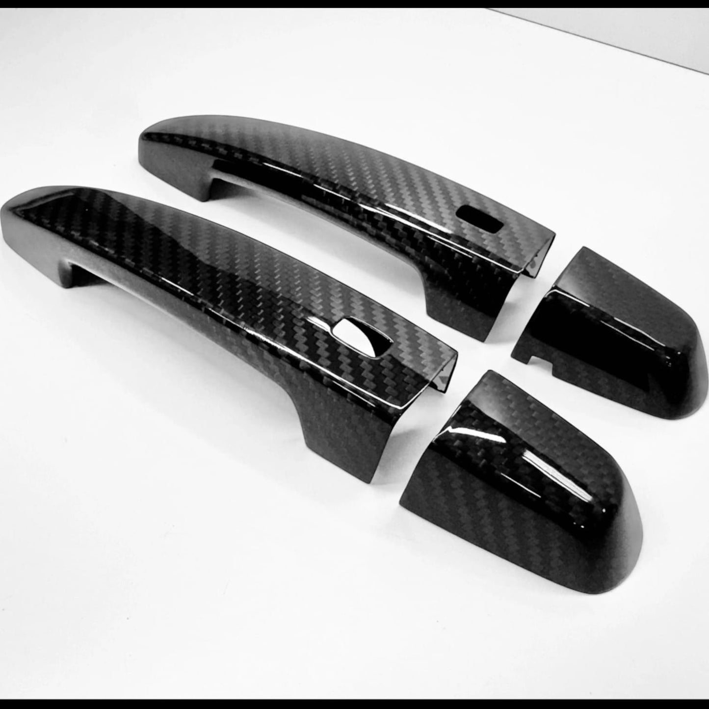 
                  
                    Rebel Carbon Fiber door handle covers for 2016-2024 Chevrolet Camaro in high-gloss genuine carbon fiber weave.
                  
                
