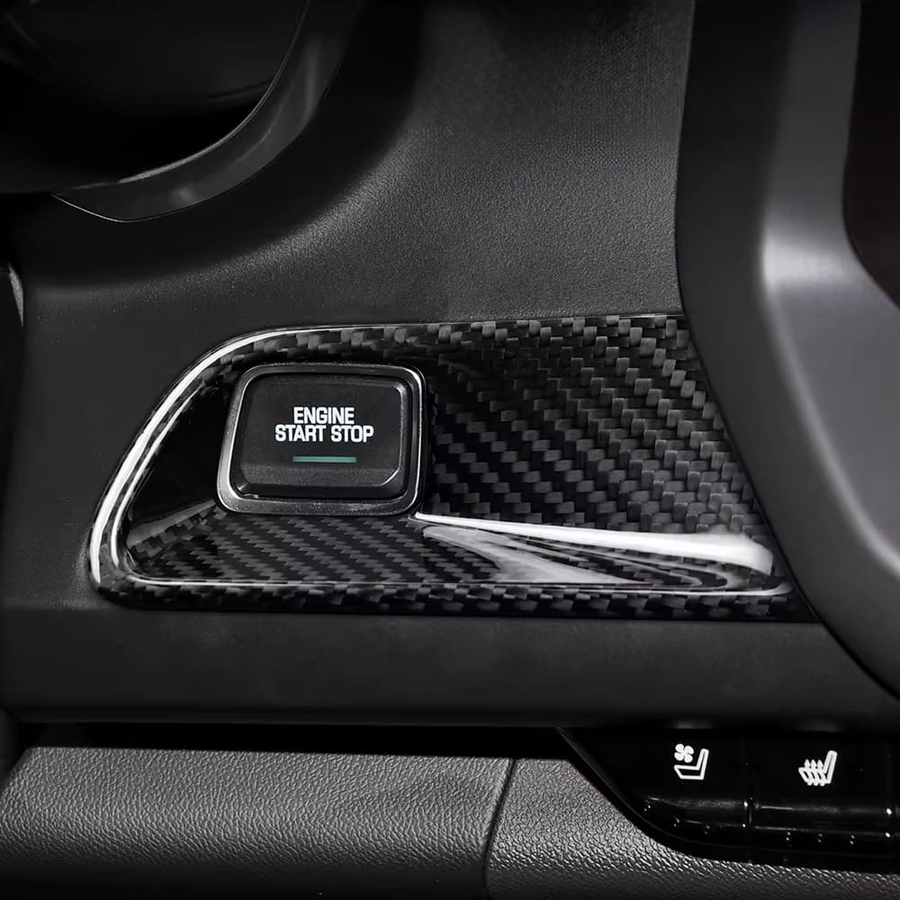 Rebel Carbon Fiber start stop button surround cover with a glossy 2x2 twill weave finish for 6th-Gen Camaro interiors.